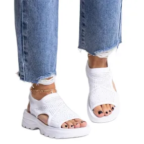 White fabric sandals on the Fnan platform